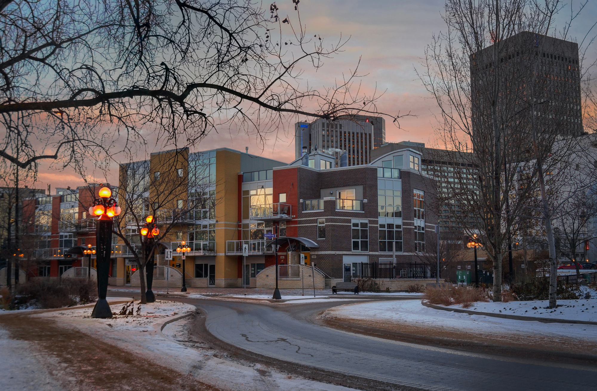 Best areas to live in Winnipeg for families — downtown neighbourhood at sunset in winter